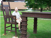 Jean in very large chair at very large table